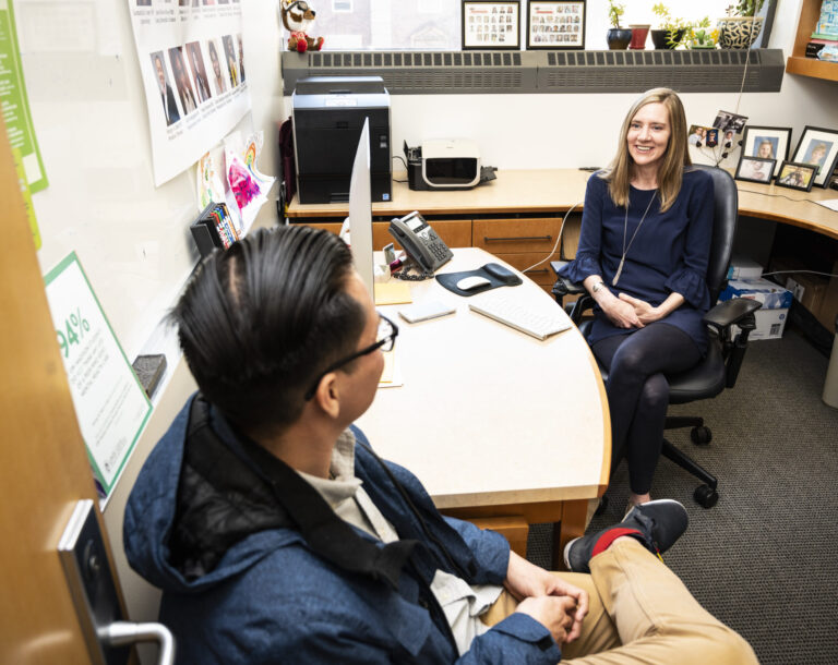 Two people talking in an office